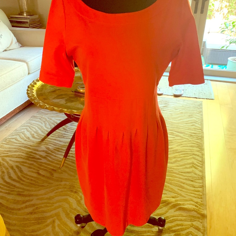 Orange red dress with exposed back zipper.